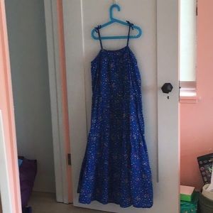Blue tank top kids dress with polka dots.